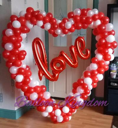 red and white organic balloon heart sculpture with love foil balloon banner
