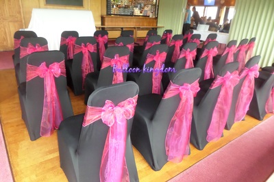 Black chair cover with fuchsia pink organza sash 
