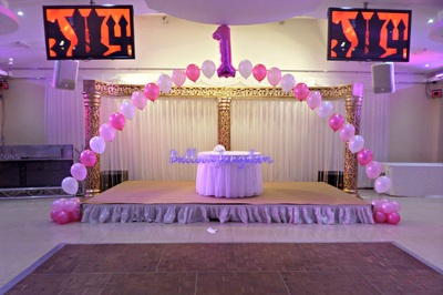 large pearl arch with foil balloon centre