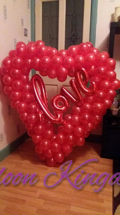 4 foot balloon heart sculpture with foil love banner balloon centre