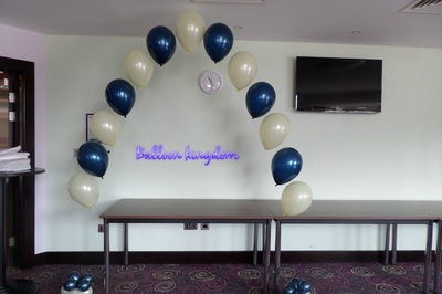 navy and ivory cake table balloon arch
