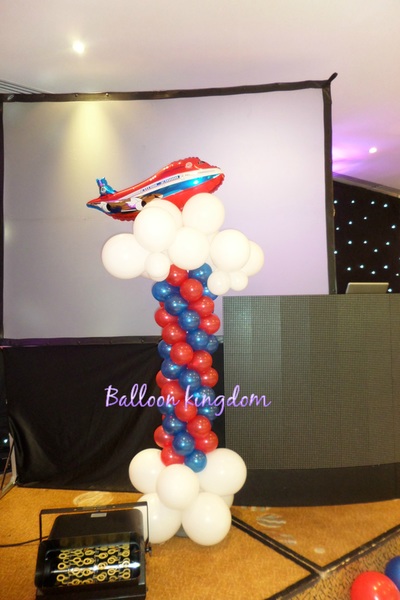 balloon column with clouds and aeroplane 