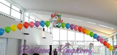 large pearl arch with foil unicorn balloon centre