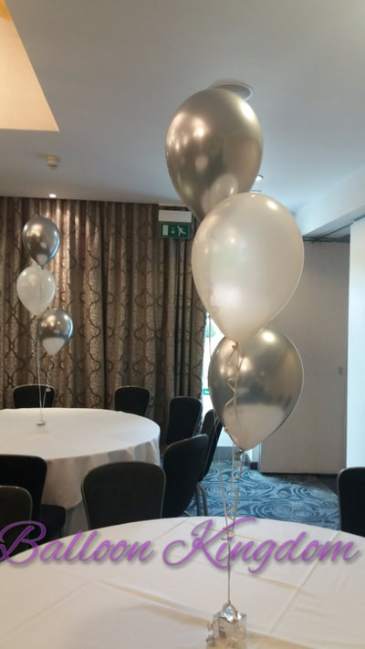 silver chrome and white balloon cluster